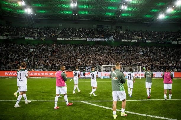 The Team of Borussia Moenchengladbach celebrate with their fans after the Bundesliga match between Borussia Moenchengladbach and Borussia Dortmund at...