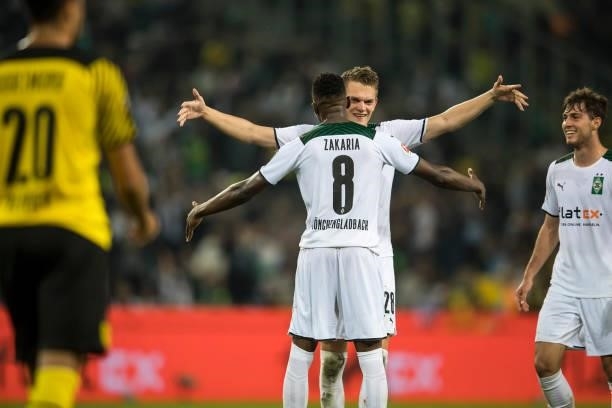 Matthias Ginter and Denis Zakaria of Borussia Moenchengladbach celebrate after the Bundesliga match between Borussia Moenchengladbach and Borussia...