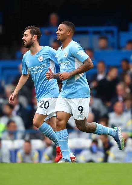 Gabriel Jesus of Manchester City celebrates scoring his goal with Bernardo Silva during the Premier League match between Chelsea and Manchester City...