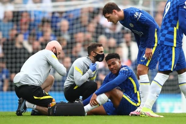 Reece James of Chelsea is treated before leaving the game injured during the Premier League match between Chelsea and Manchester City at Stamford...