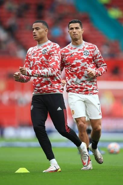 Mason Greenwood of Manchester United wamrs up ahead of Cristiano Ronaldo of Manchester United before the Premier League match between Manchester...