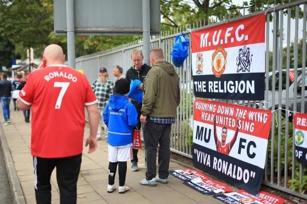Flags and banners bearing the face of Cristiano Ronaldo of Manchester United for sale before Premier League match between Manchester United and Aston...