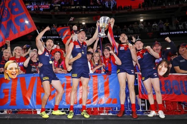 Alex Neal-Bullen of the Demons, Tom McDonald of the Demons, Jake Lever of the Demons and Jake Bowey of the Demons celebrate with the premiership cup...