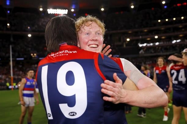 Clayton Oliver of the Demons and Fraser Rosman of the Demons celebrate during the 2021 Toyota AFL Grand Final match between the Melbourne Demons and...