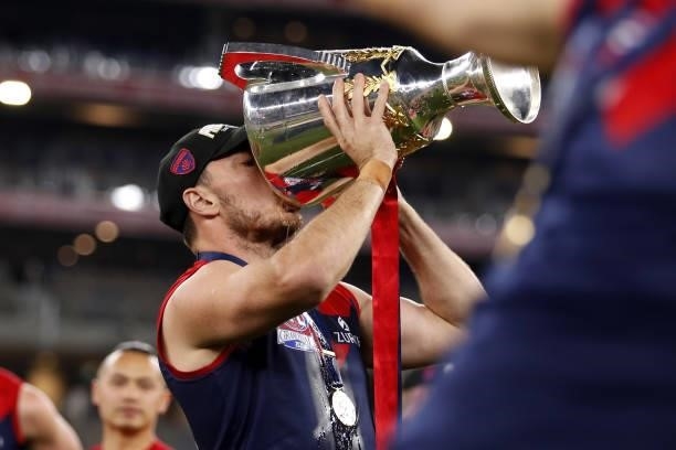 Michael Hibberd of the Demons takes a drink from the premiership cup during the 2021 Toyota AFL Grand Final match between the Melbourne Demons and...