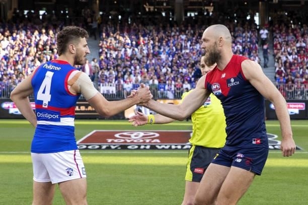 Marcus Bontempelli of the Bulldogs and Max Gawn of the Demons are seen at the coin toss during the 2021 Toyota AFL Grand Final match between the...