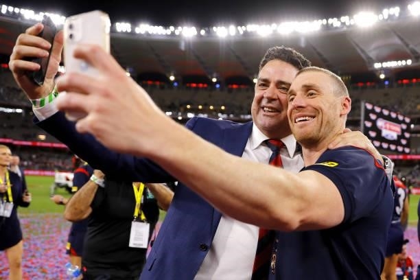 Garry Lyon and Simon Goodwin, Senior Coach of the Demons celebrate during the 2021 Toyota AFL Grand Final match between the Melbourne Demons and the...