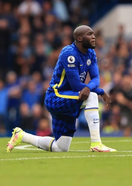 Romelu Lukaku of Chelsea takes a knee during the Premier League match between Chelsea and Manchester City at Stamford Bridge on September 25, 2021 in...