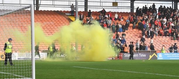 Barnsley fans throw flares onto the pitch during the Sky Bet Championship match between Blackpool and Barnsley at Bloomfield Road on September 25,...