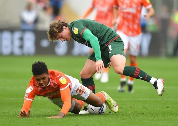 Blackpool's Tyreece John-Jules battles with Barnsley's Callum Styles during the Sky Bet Championship match between Blackpool and Barnsley at...