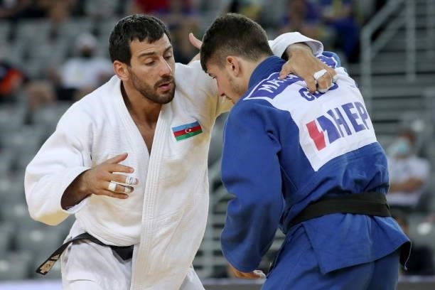 Mammadali Mehdiyev of Azerbaijan and Luka Maisuradze of Georgia compete in the Men's -90kg final match during day 3 of the Judo Grand Prix Zagreb...