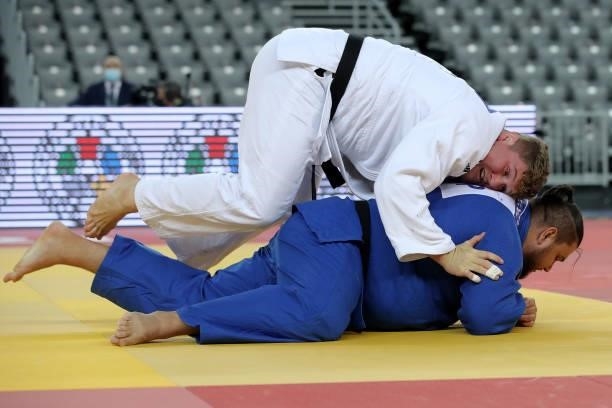 Jur Spijkers of Netherlands and Vladut Simionescu of Romania compete in the Men's +100kg final match during day 3 of the Judo Grand Prix Zagreb 2021...