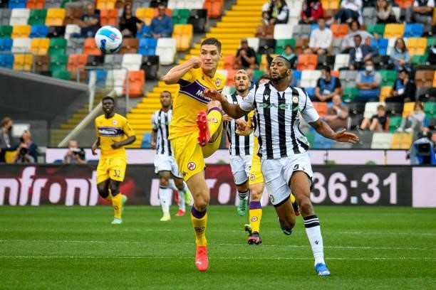 Nikola Milenkovic carries the ball hindered by Norberto Bercique Gomes Betuncal during the Italian football Serie A match Udinese Calcio vs ACF...