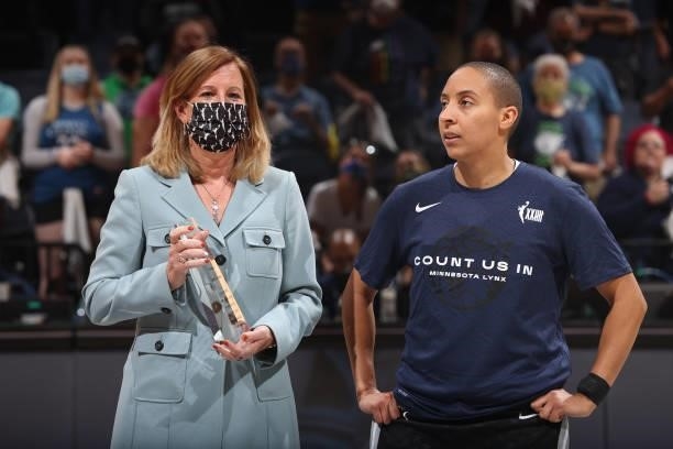 Commissioner, Cathy Engelbert presents Layshia Clarendon of the Minnesota Lynx with the August WNBA Cares Community Assist Award before the game...