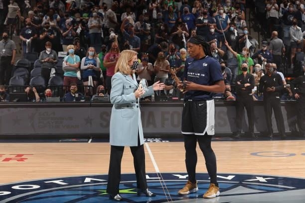Commissioner, Cathy Engelbert presents Sylvia Fowles of the Minnesota Lynx with the 2021 Kia WNBA Defensive Player of the Year Award before the game...