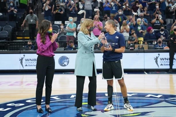 Commissioner Cathy Engelbert presents Layshia Clarendon of the Minnesota Lynx with the August WNBA Cares Community Assist Aware presented by State...