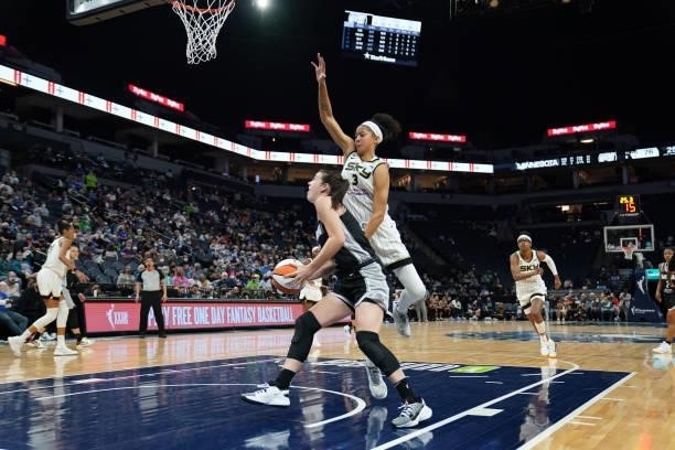 Candace Parker of the Chicago Sky reaches to block a shot by Bridget Carleton of the Minnesota Lynx during the 2021 WNBA Playoffs on September 26,...