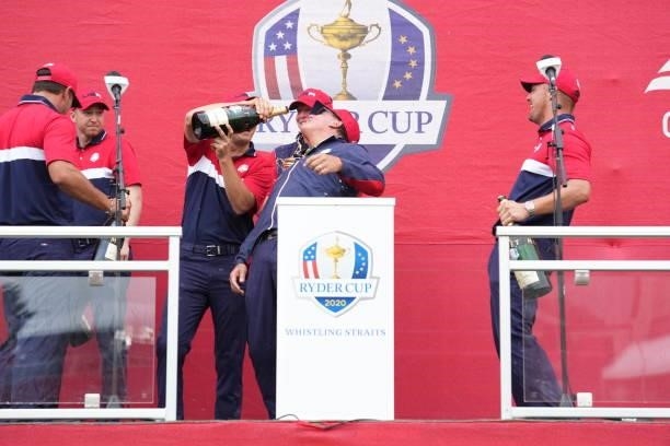 United States Vice-Captain Phil Mickelson has champagne poured into his mouth after the United States victory in the 2020 Ryder Cup at Whistling...