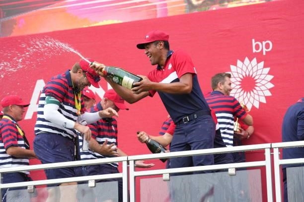 Tony Finau of Team United States squirts champagne after their victory in the 2020 Ryder Cup at Whistling Straits on September 26, 2021 in Kohler,...