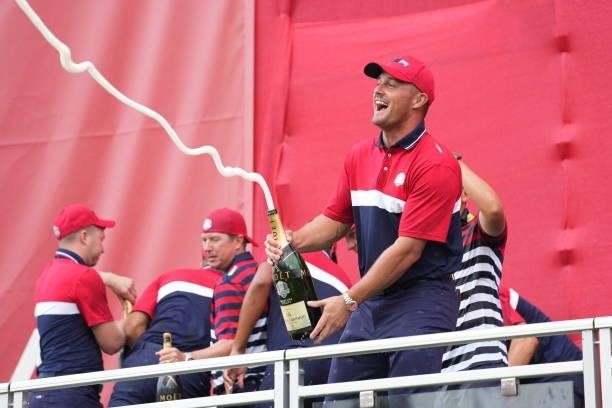Bryson DeChambeau of Team United States squirts champagne after their victory in the 2020 Ryder Cup at Whistling Straits on September 26, 2021 in...