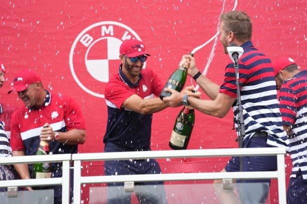 Dustin Johnson of Team United States squirts champagne after their victory in the 2020 Ryder Cup at Whistling Straits on September 26, 2021 in...
