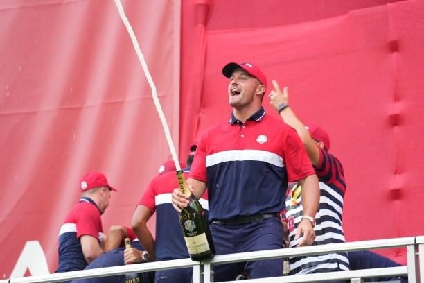 Bryson DeChambeau of Team United States squirts champagne after their victory in the 2020 Ryder Cup at Whistling Straits on September 26, 2021 in...
