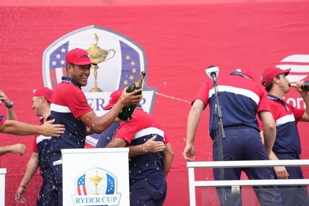 Tony Finau of Team United States squirts champagne after their victory in the 2020 Ryder Cup at Whistling Straits on September 26, 2021 in Kohler,...
