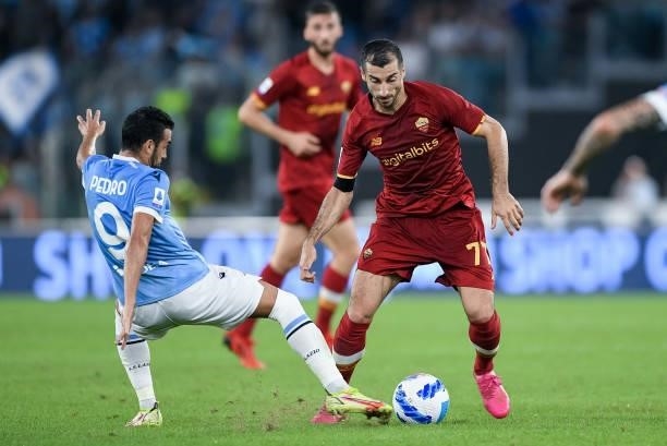Henrikh Mkhitaryan of AS Roma and Pedro of SS Lazio compete for the ball during the Serie A match between SS Lazio and AS Roma at Stadio Olimpico,...