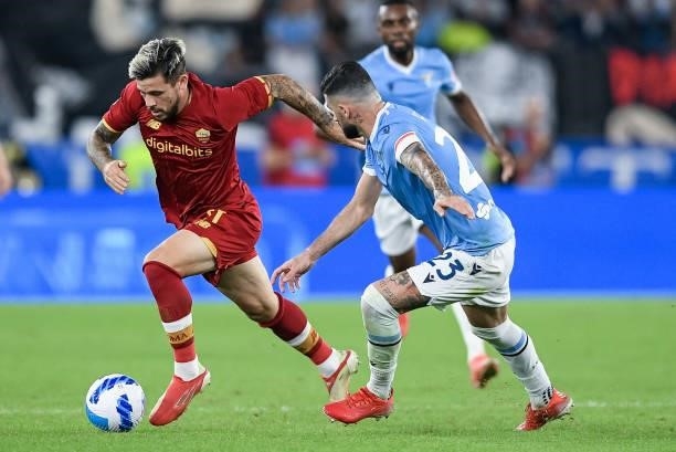 Carles Perez of AS Roma and Elseid Hysaj of SS Lazio compete for the ball during the Serie A match between SS Lazio and AS Roma at Stadio Olimpico,...
