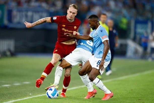 Rick Karsdorp of AS Roma and Jean-Daniel Akpa Akpro of SS Lazio battle for the ball during the Serie A match between SS Lazio and AS Roma at Stadio...