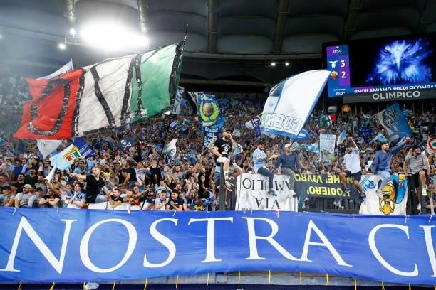 Lazio supporters celebrate during the Serie A match between SS Lazio and AS Roma at Stadio Olimpico on September 26, 2021 in Rome, Italy.