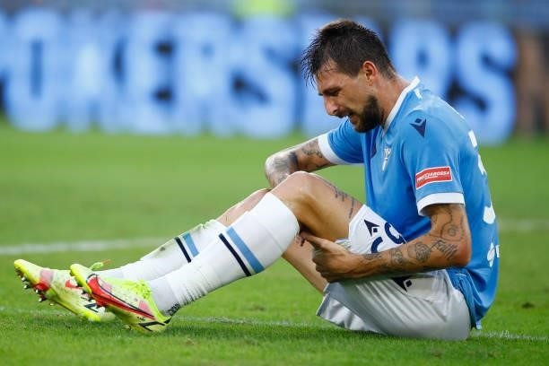 Francesco Acerbi of SS Lazio lies on the ground during the Serie A match between SS Lazio and AS Roma at Stadio Olimpico on September 26, 2021 in...