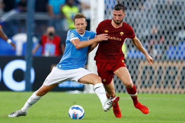 Lucas Leiva of SS Lazio and Bryan Cristante of AS Roma battle for the ball during the Serie A match between SS Lazio and AS Roma at Stadio Olimpico...