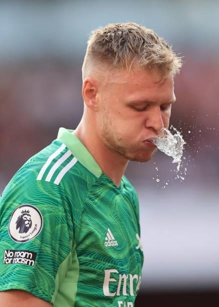 Aaron Ramsdale of Arsenal spits water during the Premier League match between Arsenal and Tottenham Hotspur at Emirates Stadium on September 26, 2021...
