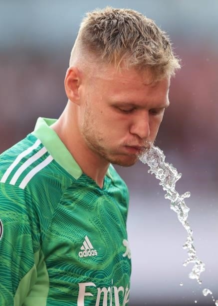 Aaron Ramsdale of Arsenal spits water during the Premier League match between Arsenal and Tottenham Hotspur at Emirates Stadium on September 26, 2021...