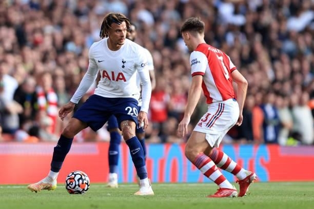 Dele Alli of Tottenham Hotspur in action with Kieran Tierney of Arsenal during the Premier League match between Arsenal and Tottenham Hotspur at...