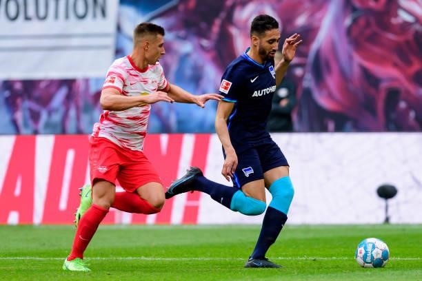 Willi Orban of RB Leipzig and Ishak Belfodil of Hertha BSC battle for the ball during the Bundesliga match between RB Leipzig and Hertha BSC at Red...