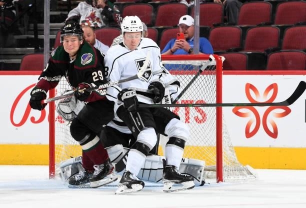 Barrett Hayton of the Arizona Coyotes battles for position with Jaret Anderson-Dolan of the Los Angeles Kings in front of the Kings net at Gila River...