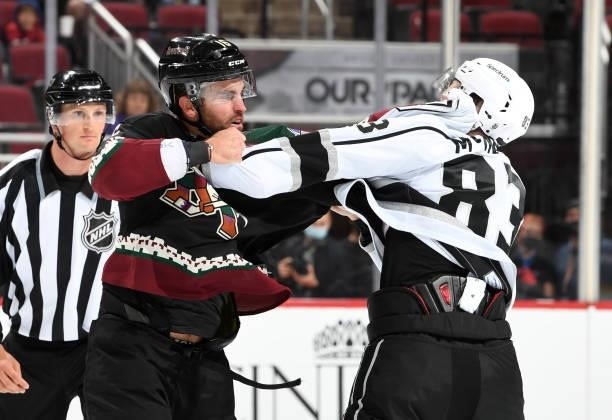Andrew Ladd of the Arizona Coyotes fights with Cade McNelly of the Los Angeles Kings at Gila River Arena on September 27, 2021 in Glendale, Arizona.