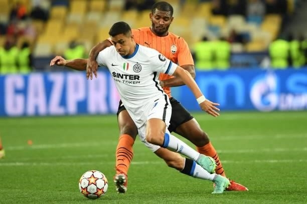Shakhtar Donetsk's Brazilian defender Marlon and Inter Milan's Chilean forward Alexis Sanchez vie for the ball during the UEFA Champions League...