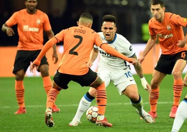 Shakhtar Donetsk's Brazilian midfielder Dodo and Inter Milan's Argentine forward Lautaro Martinez vie for the ball during the UEFA Champions League...
