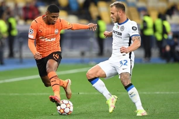 Shakhtar Donetsk's Brazilian forward Tete and Inter Milan's Italian defender Federico Dimarco vie for the ball during the UEFA Champions League...
