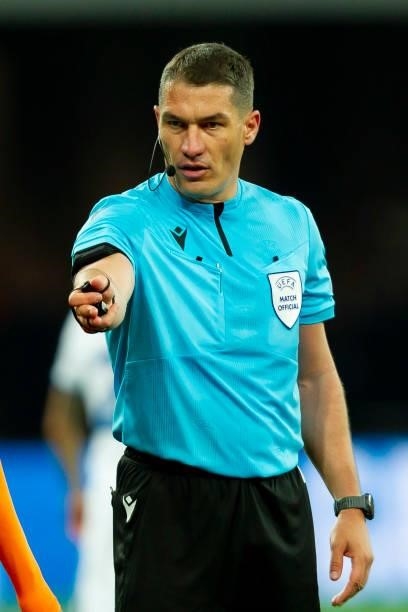 Referee Istvan Kovacs gestures during the UEFA Champions League group D match between Shakhtar Donetsk and Inter at Metalist Stadium on September 28,...