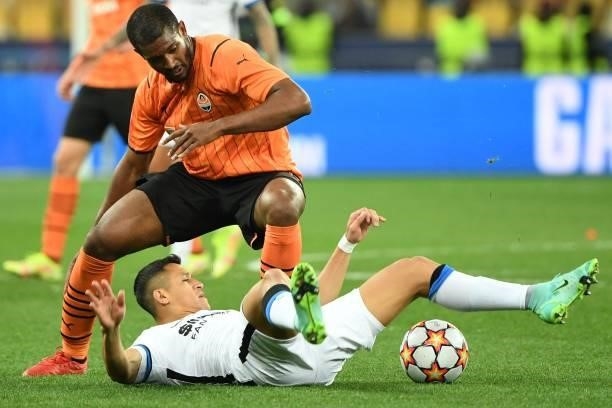 Shakhtar Donetsk's Brazilian defender Marlon and Inter Milan's Chilean forward Alexis Sanchez vie for the ball during the UEFA Champions League...
