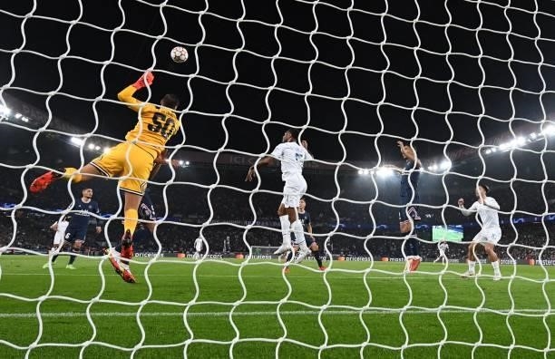 Manchester City's English midfielder Raheem Sterling heads the ball past Paris Saint-Germain's Italian goalkeeper Gianluigi Donnarumma but hits the...