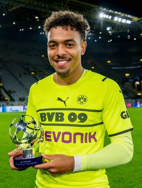 Donyell Malen of Borussia Dortmund with his Man Of The Match trophy after the final whistle during the Champions League Group C match between...