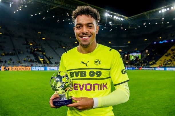 Donyell Malen of Borussia Dortmund with his Man Of The Match trophy after the final whistle during the Champions League Group C match between...