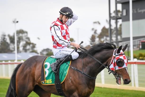 Jordan Childs returns to the mounting yard on Narvaez after winning the JT Dixon BM64 Handicap, at Geelong Racecourse on September 29, 2021 in...