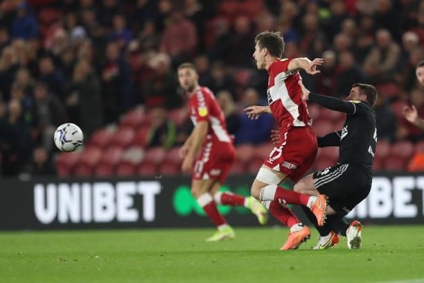 Sheffield United's John Fleck challenges Middlesbrough's Paddy McNair during the Sky Bet Championship match between Middlesbrough and Sheffield...