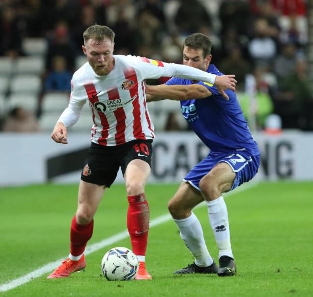 Aiden O'Brien of Sunderland and Matty Blair of Cheltenham Town in action during the Sky Bet League 1 match between Sunderland and Cheltenham Town at...
